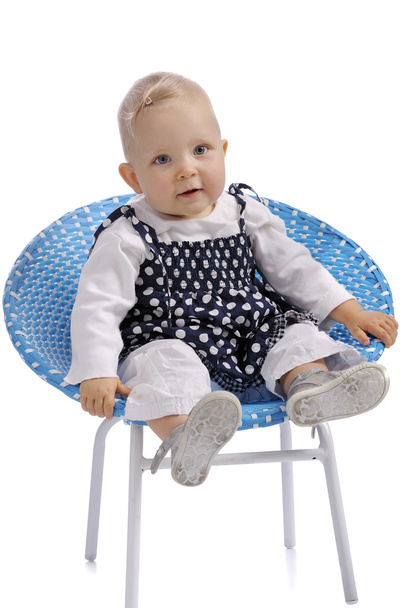 cute little baby girl sitting in a chair - Photo, Image