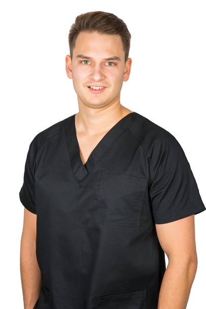Young male dentist in black uniform - Fotó, kép