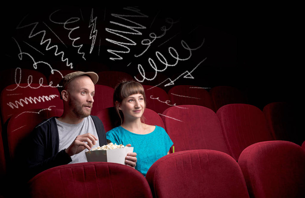 Cute couple in cinema watching movie  - Fotó, kép