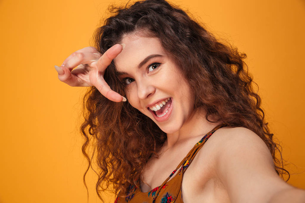 Close up portrait of a cheerful curly haired girl - Φωτογραφία, εικόνα
