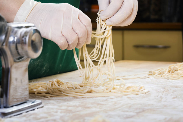 Fresh pasta  on kitchen table - Fotó, kép