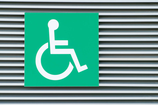 Disabled symbol with the green background - Photo, Image