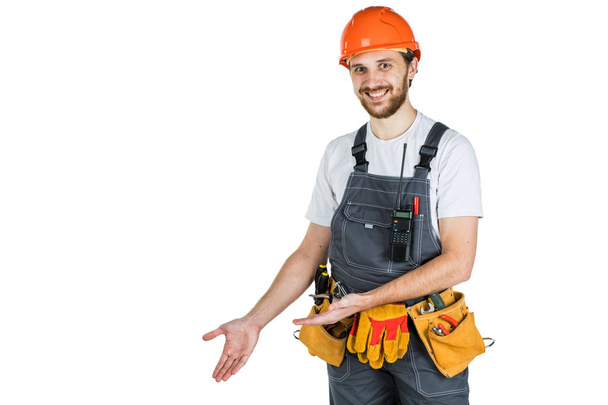 The man builder shows something. Isolated over white background - Photo, Image