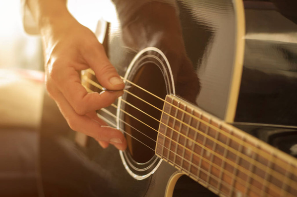 playing acoustic guitar - Фото, изображение