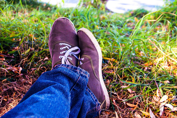 Masculine feet in jeans and moccasins - Photo, Image