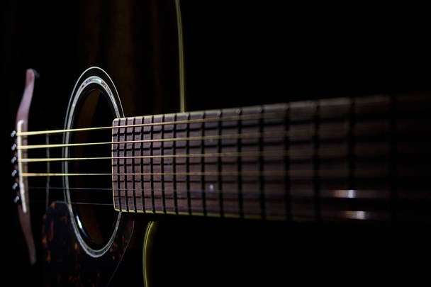 Acoustic guitar on black background - Photo, Image