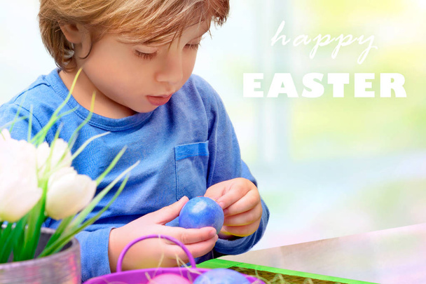Little boy decorating Easter eggs - Photo, Image