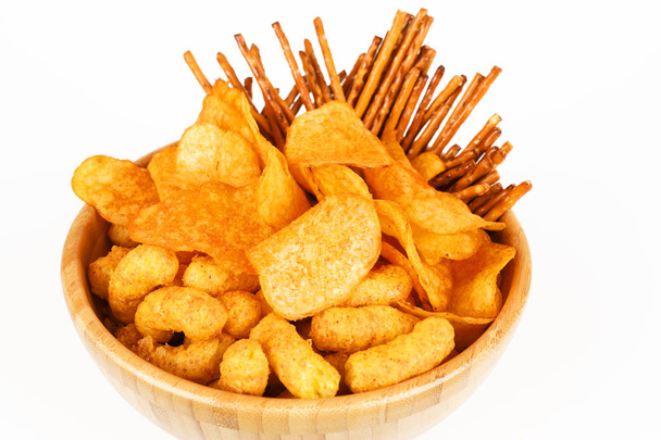 different salty snacks in a bowl - Photo, Image
