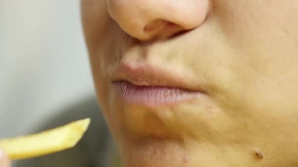 young woman eats french fries. fast and junk food concept. slow motion - Felvétel, videó