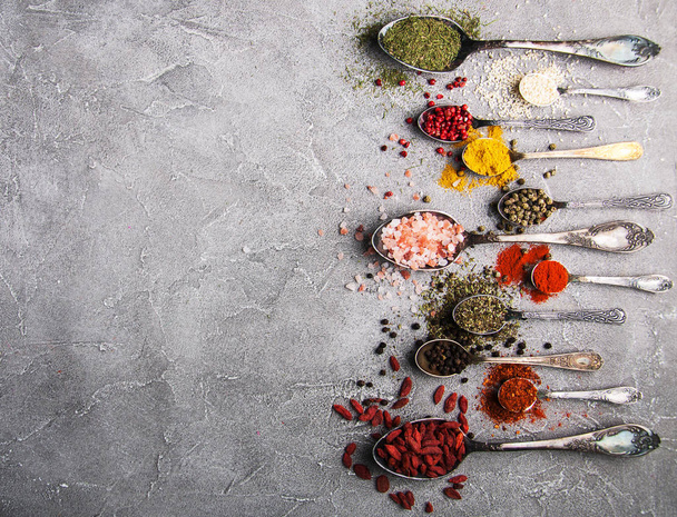 Different kind of spices in vintage spoons - Photo, Image