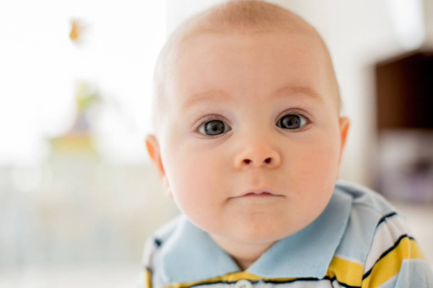 Portrait of a cute  infant baby boy. Happy childhood concept. - Fotó, kép