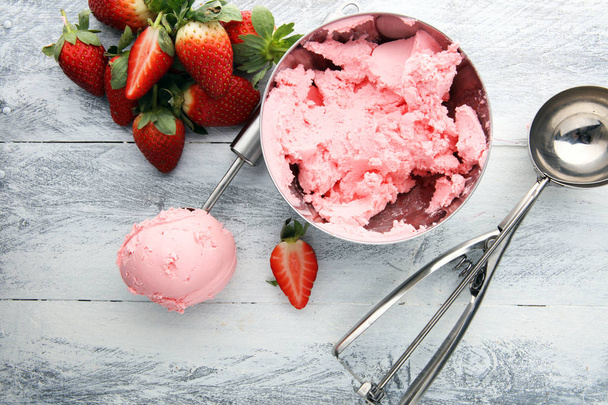 Delicious strawberry ice cream scoop with fresh strawberries - Photo, Image