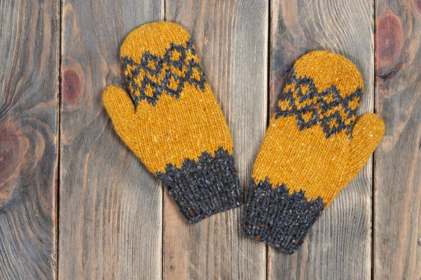 Yellow mittens are handmade. View from above. - Photo, Image