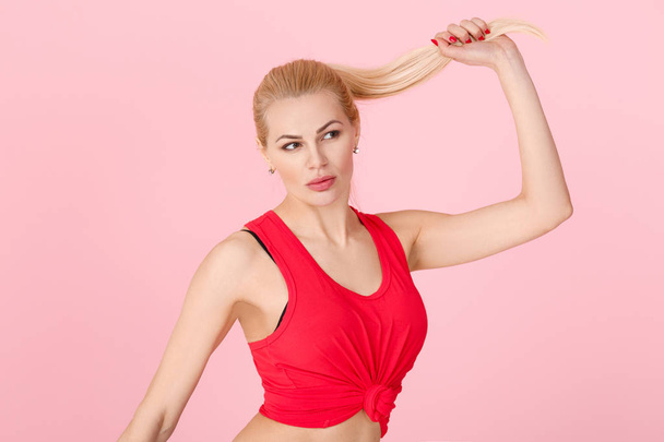 woman in red fitness clothes - Фото, изображение