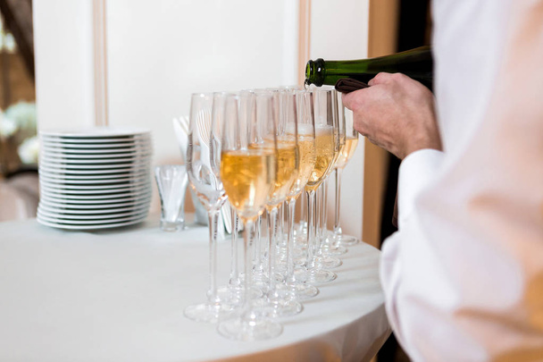 waiter pours champagne - Fotó, kép