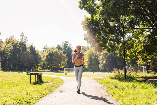 healthy lifestyle young fitness woman running outdoors - Foto, Imagem