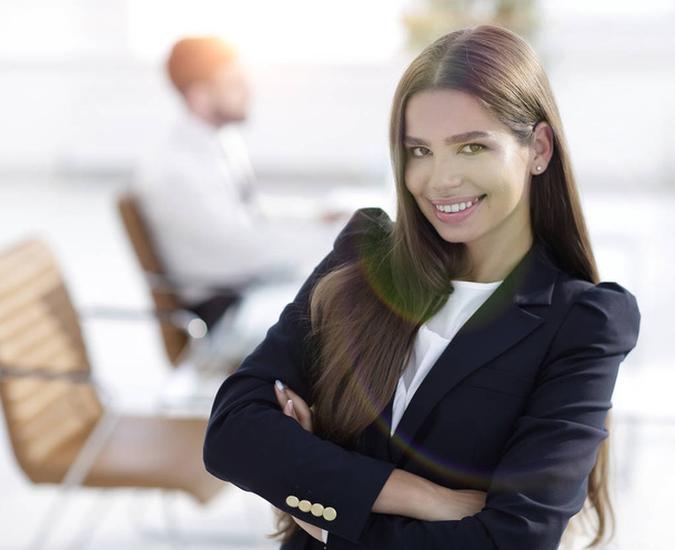 young business woman on the background of the office - Φωτογραφία, εικόνα