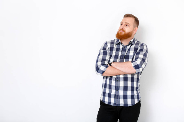 man with red hair and beard in plaid shirt - Fotó, kép