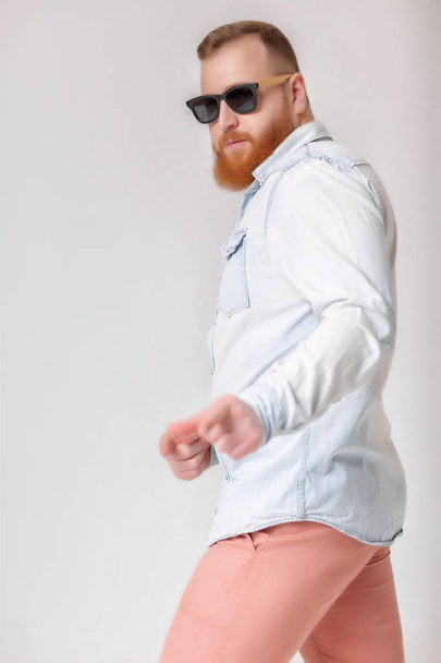 beard man in sunglasses and denim shirt - Фото, изображение