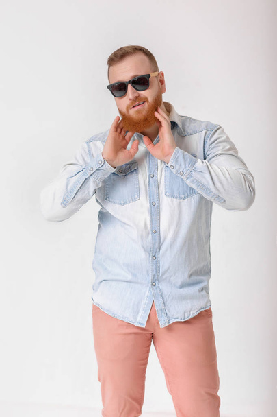 beard man in sunglasses and denim shirt - Photo, image