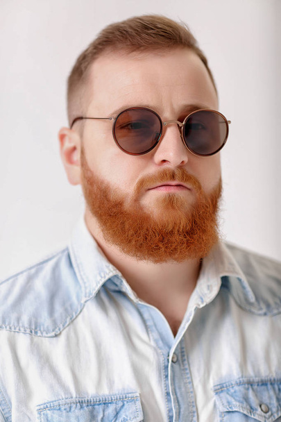 beard man in sunglasses and denim shirt - 写真・画像