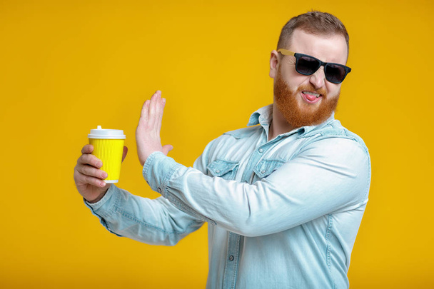 red beard man holding cup with coffee - Valokuva, kuva