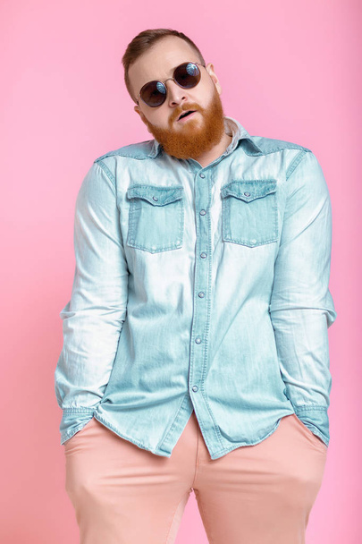 beard man in sunglasses and denim shirt - Фото, изображение