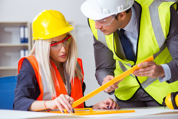 Construction workers having discussion in office before starting - Photo, Image