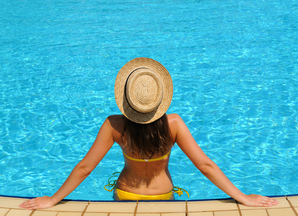 Woman at poolside - Photo, Image