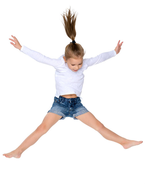 Little girl is jumping. - Фото, изображение