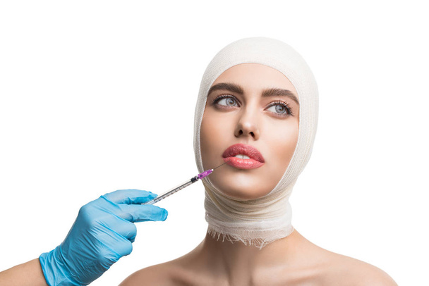Girl her head bandaged getting beauty injections - Fotografie, Obrázek