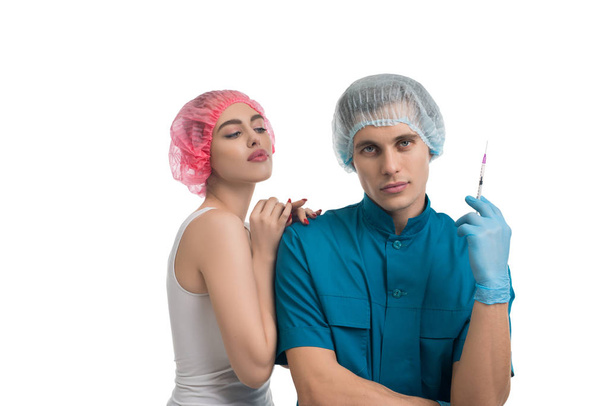 Plastic surgeon with his female pretty patient - Fotoğraf, Görsel