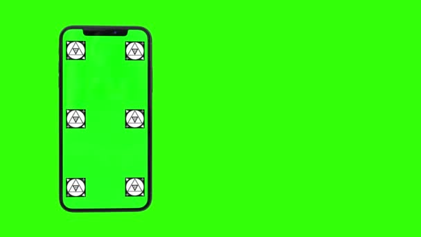 Elszigetelt szúró telefon-val zöld képernyő - Felvétel, videó