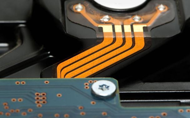 Back side of hard disk drive with orange tire - Photo, Image