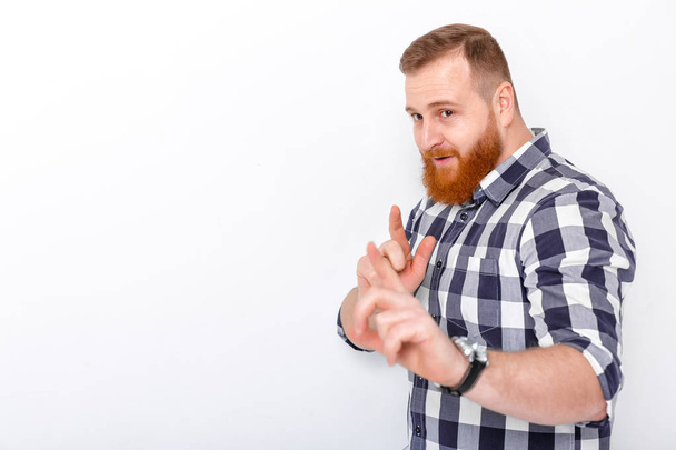 man with red hair and beard in plaid shirt - Foto, afbeelding