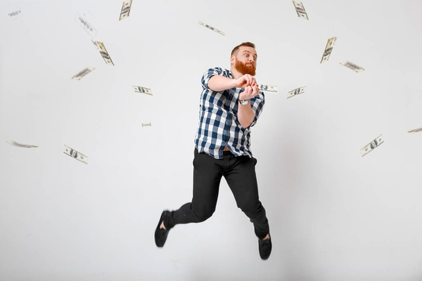 man standing under money rain - Photo, image