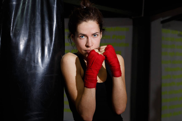 thin girl at a boxing training in a gym  - Φωτογραφία, εικόνα