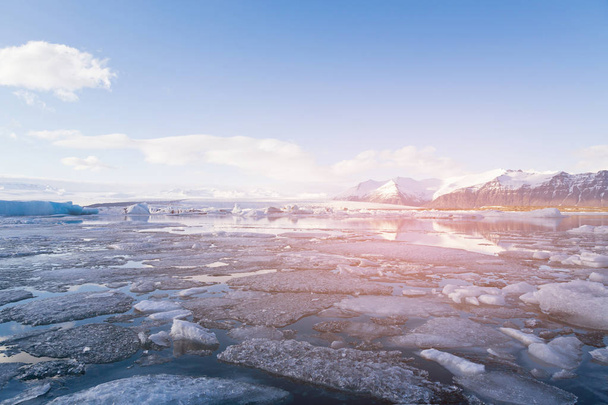 Beautiful Jokulsarlon glacier freezing ice lake, winter season natural landscape background - Fotó, kép