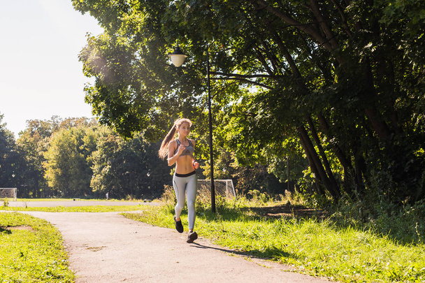 healthy lifestyle young fitness woman running outdoors - Foto, Bild