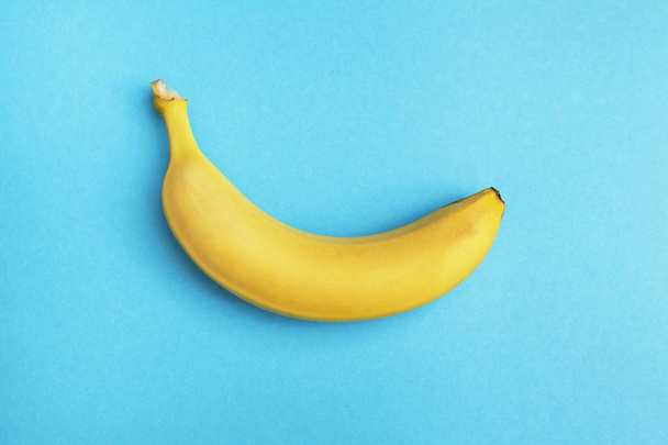 fresh ripe banana isolated on blue background - Foto, Imagem