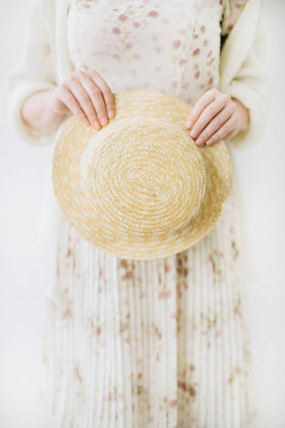 Young woman in dress hold straw hat. - Fotoğraf, Görsel