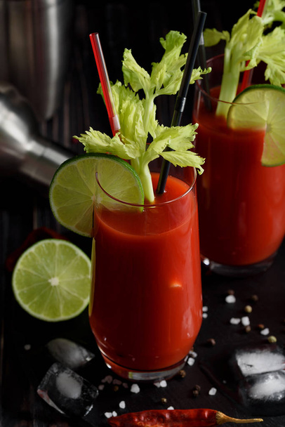 Bloody mary cocktail and ingredients: peper chili, lime, celery, - Foto, Imagen
