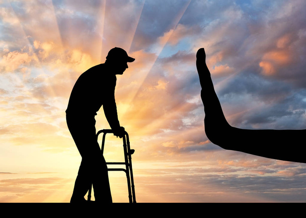 Silhouette d'un homme avec une marchette pour handicapés et arrêt du geste de la main
 - Photo, image