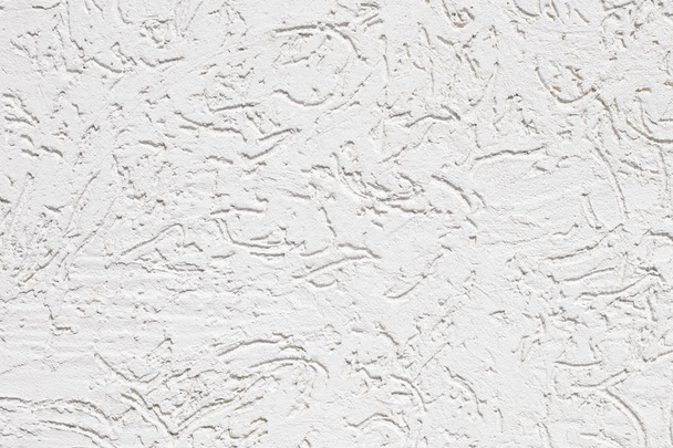 Foto de cerca de estuco blanco agrietado pared
 - Foto, Imagen