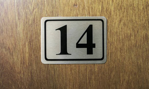 Address number in a wooden door - 写真・画像