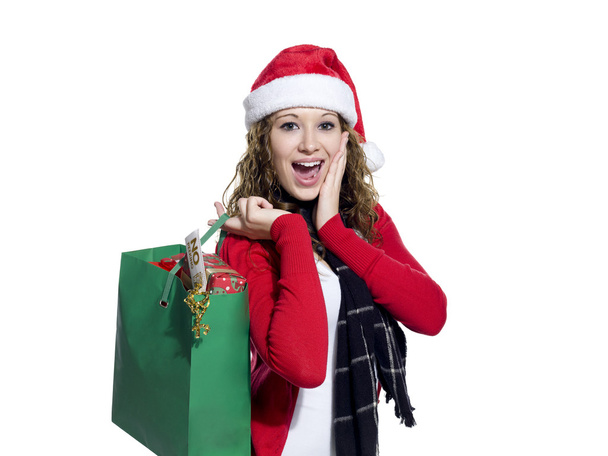 young woman holding shopping bags with mouth open - Foto, Imagen