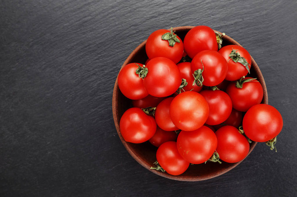 Red tomatoes, Tomatoes background. Black background. - Photo, image