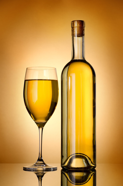 Bottle over gold background - 写真・画像
