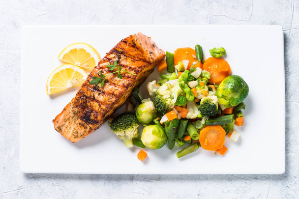 Grilled salmon fillet with vegetables mix.  - Photo, Image