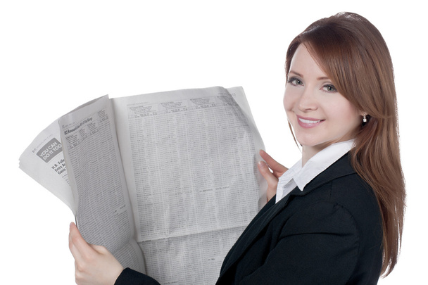 a happy businesswoman reading newspaper - Фото, зображення
